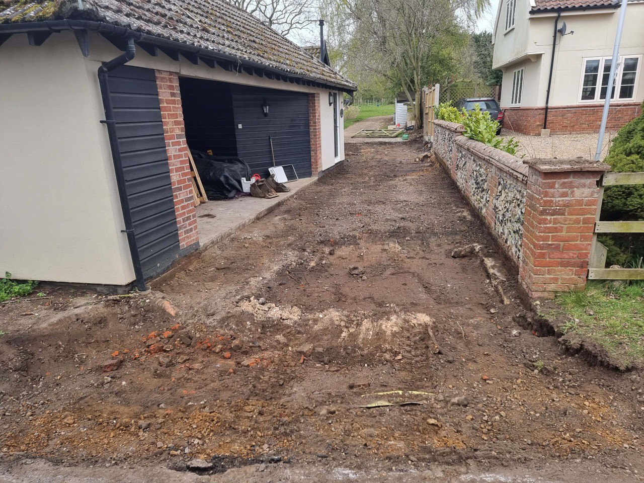 This is a tarmac driveway that is in the process of being dug out and installed by NS Driveways Weybridge